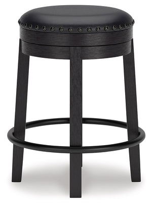  while the nailhead trim brings effortless style. Black faux leather upholstery keeps thing