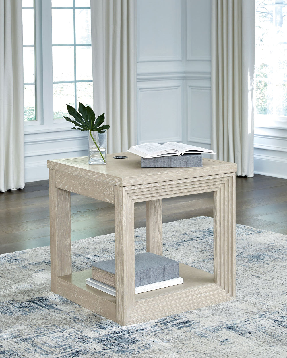 Transitional design takes on a contemporary look with this end table. Its trend-right glazed bisque finish elevates your interior space with a clean, modern palette. Add decor to the lower shelf and soak in all of the style. Convenient wireless charging m