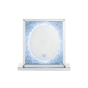 The Noralie mirror offers function and style to any modern setting. This rectangular mirror features LED lighting that operates through touch control. Its frame crafted from durable engineered wood and features beveled mirrored border trim with faux diamo