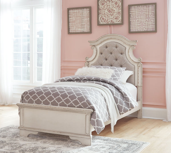 Elevating the art of traditional cottage styling, this twin upholstered bed is your dream bedroom retreat realized. A curvaceous beauty, this brilliant upholstered bed wows with dramatic scalloped details and fanciful trim work. The distressed chipped whi