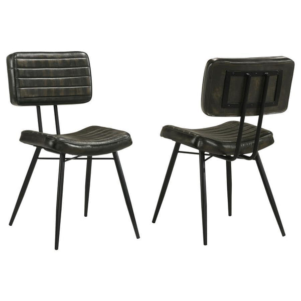 Blending industrial edge with vintage charm, this dining side chair is a striking addition to any dining space. Upholstered in hand-dyed genuine goat leather, the padded seat and backrest offer both comfort and durability. Vertical tufting details enhance