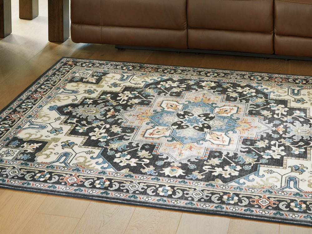 Chic traditional style is made all the more convenient with this rug. It showcases a brilliant medallion pattern, weaving together dark and light tones for incredible dimension. No need to sweat spills and messes: Simply toss this rug into the washer for 