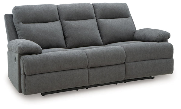 Fully upright or completely stretched out, this traditional-inspired reclining sofa caters to the art of relaxation. Super soft charcoal-colored upholstery and sumptuous cushioningâ€”made all the more indulgent with pillow top armsâ€”cradles you in comfor