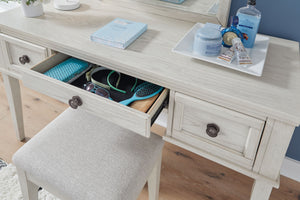  timeless furnishings take your bedroom to the next level. Nothing does that better than this vanity and stool set. The antiqued white finish with a wonderful grain texture radiates sophistication