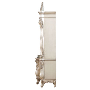  decorated with raised and oversized scrolled moldings in an antique champagne finish. This sophisticated l