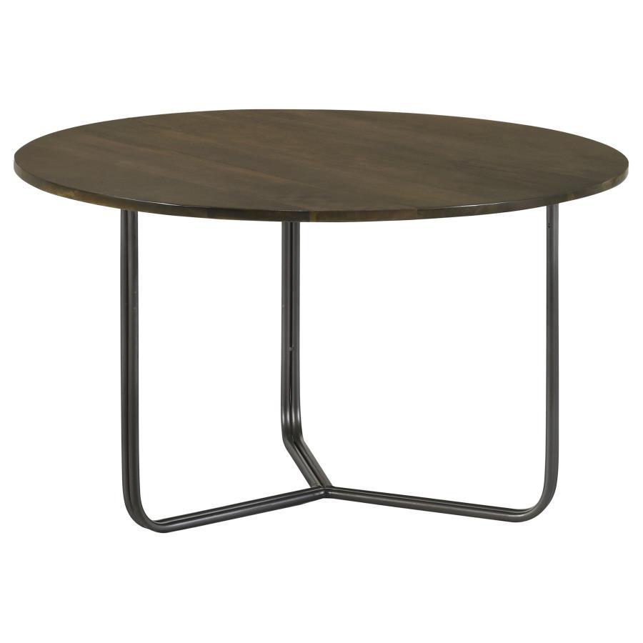 Blending industrial charm with modern minimalism, this round accent table is the perfect complement to any seating arrangement. Crafted from eco-friendly solid mango wood, the spacious tabletop showcases a warm natural finish, bringing organic beauty to y