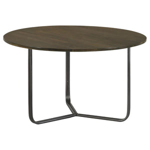 Blending industrial charm with modern minimalism, this round accent table is the perfect complement to any seating arrangement. Crafted from eco-friendly solid mango wood, the spacious tabletop showcases a warm natural finish, bringing organic beauty to y