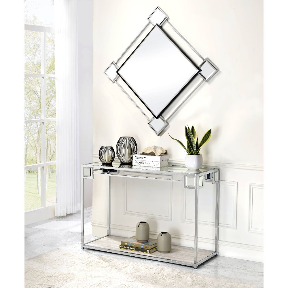 Great addition to maximize the sunlight and expand your space, this Asbury wall mirror will light up the room and add an elegant flair to the atmosphere. Featuring a diamond shape, the metal frame is finished with a mirrored trim along with a geometric pa