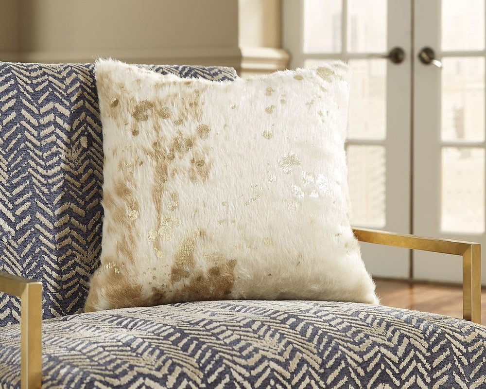 This faux fur accent pillow makes indulgence comfortably affordable. Masterful mix of cream and goldtone hues is a delightful change from the ordinary. Cozy feel is the essence of luxury living.<br/><br/><b>Product Features</b><ul><li>Faux fur (acrylic) f