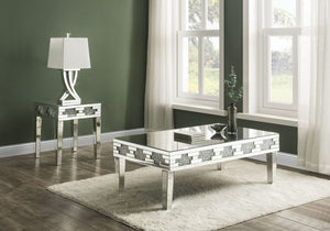 Undeniably magnificence with glam flair, this Noralie End Table is meant to become your favorite focus in your living room. Mirrored accents with faux stones inlay achieve a modern glamour look. This piece makes a glam style statement that offers a satin 