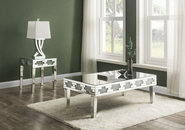 Undeniably magnificence with glam flair, this Noralie End Table is meant to become your favorite focus in your living room. Mirrored accents with faux stones inlay achieve a modern glamour look. This piece makes a glam style statement that offers a satin 