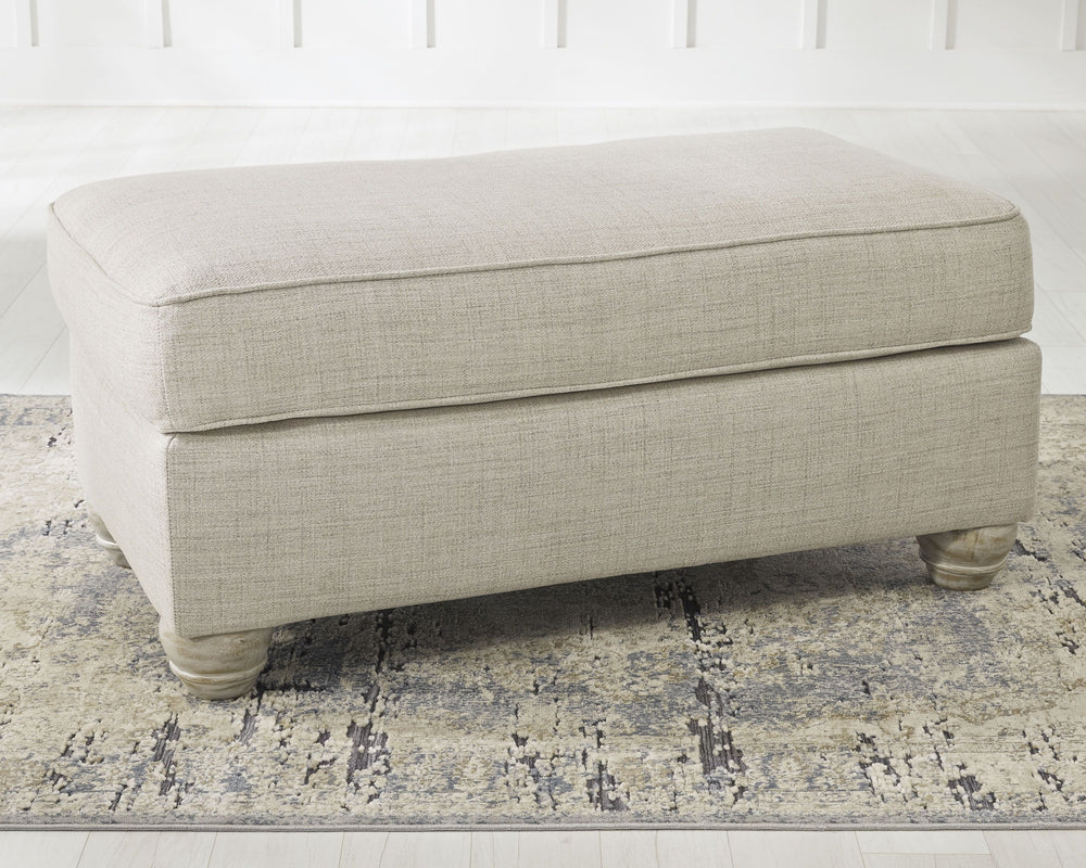 Donâ€™t be shyâ€”find your footing on this farmhouse-style ottoman. Dressed in a modern and relaxed linen-weave upholstery, itâ€™s a luxurious complement to rustic accents with its light and airy palette and elegantly turned feet. What a picture-perfect f