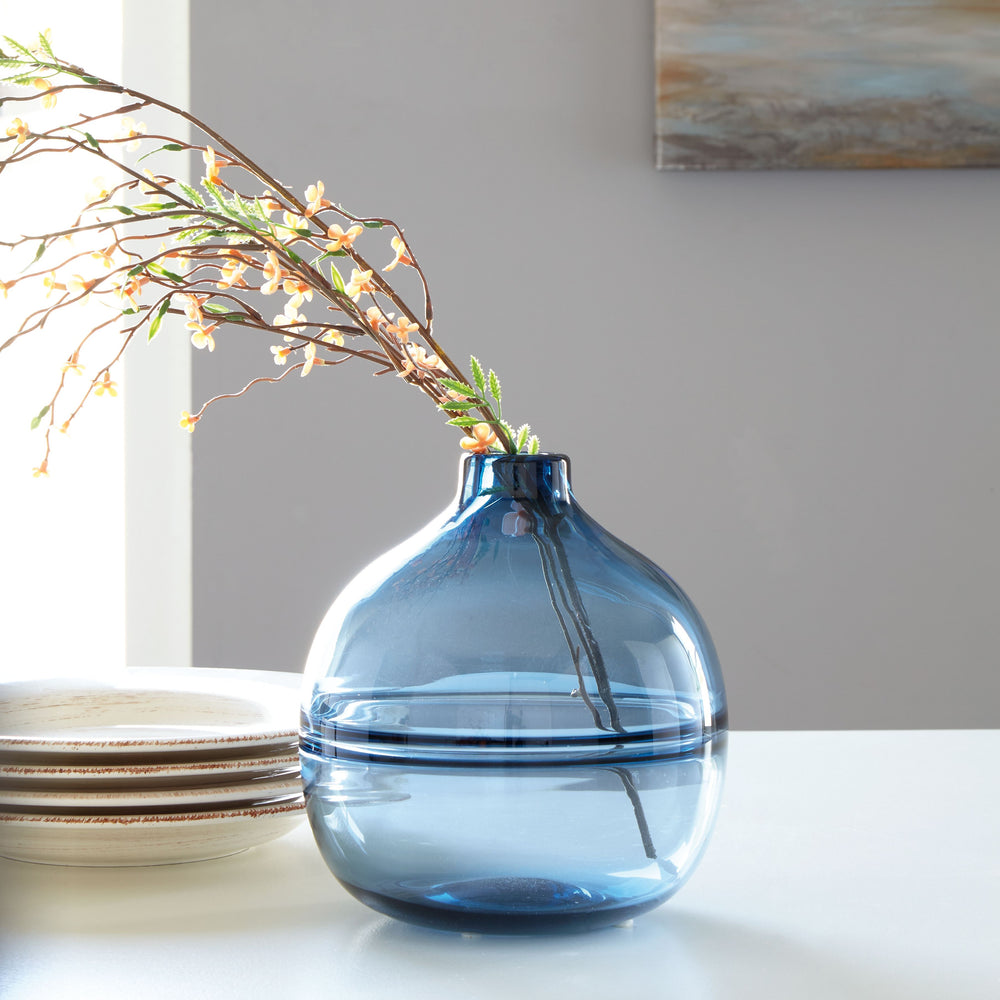 Polish off your patio dining table or office bookshelf with the unassuming-yet-impactful styling of this vase. Its navy finish provides an opaque pop of color to your contemporary decor. Subtle in design, use this vase to punctuate the end of a mantel. Or