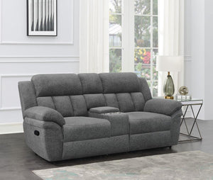  prioritizing comfort with this transitional reclining loveseat. Charcoal upholstery is smooth and soft