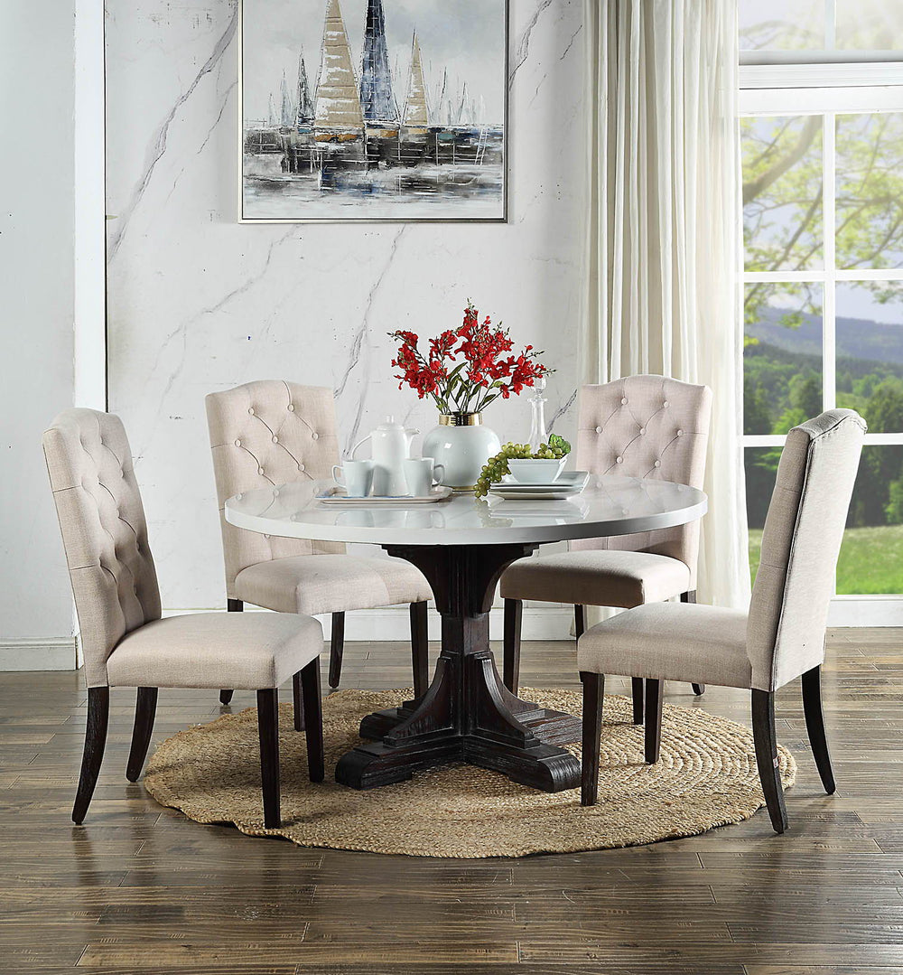 Warm wood tone paired with elegant white marble brings classic beauty into any ordinary space. The Gerardo Dining is founded atop wooden pedestal base in a weathered espresso finish, which showcases elaborate carving details on the base. White artificial 
