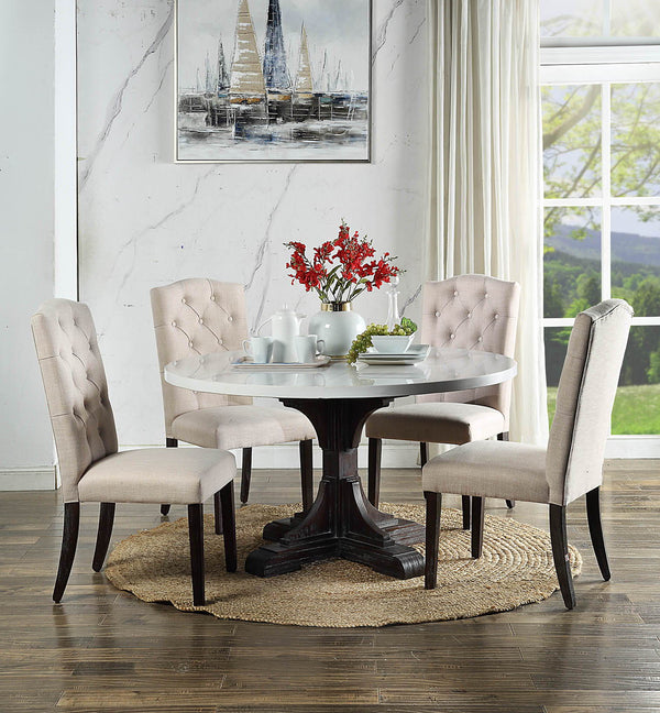 Warm wood tone paired with elegant white marble brings classic beauty into any ordinary space. The Gerardo Dining is founded atop wooden pedestal base in a weathered espresso finish, which showcases elaborate carving details on the base. White artificial 