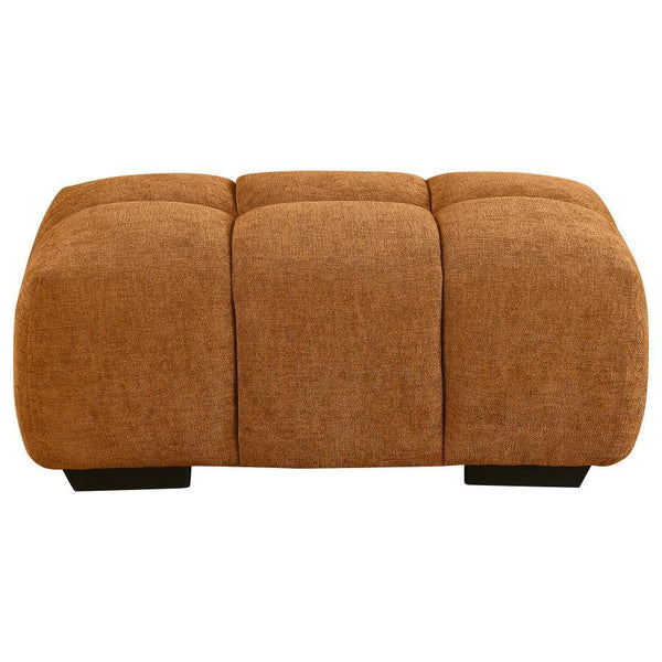  offering a great footrest for lounging. Soft upholstery in a warm hue complements surrounding decor while offering inviting contrast and depth. Th