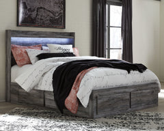 Rest in the beachy style and practicality of this queen panel storage bed. Its driftwood and surfer-inspired smoky finish gives this bed a rustic look that-'s perfect for creating an island escape in the room. Four underbed storage drawers and two footboa