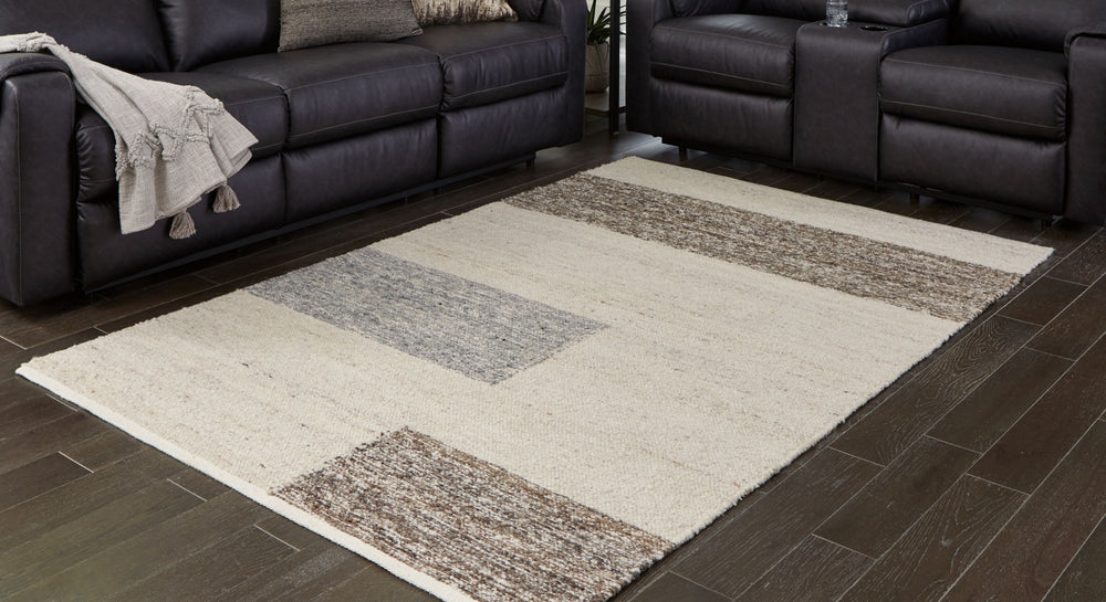 This handwoven rug exhibits classic stripes with a contemporary touch. The warm natural tones offer endless style possibilities. It-'s just what your room has been looking for.<br/><br/><b>Product Features</b><ul><li>Made of polyester</li><li>Handwoven</l