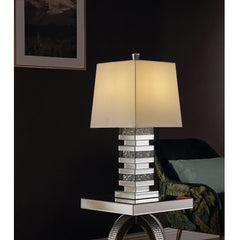 Wonderful mixture between stylish design and modern technology, this Noralie Table Lamp will bring a touch of Hollywood glamourous to any room space. Featuring novelty design with mirrored finish and trimmed with clear glass of faux diamond inlayed, this 