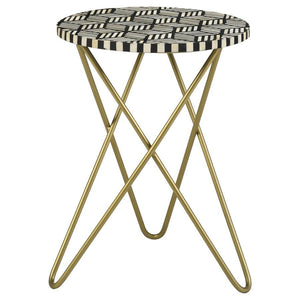 Make a bold statement with this elegant accent table, featuring a hand-inlaid bone and black resin mosaic that creates a striking geometric design. The round tabletop rests atop a sculptural butterfly-style hairpin metal base in a lustrous gold finish, ad