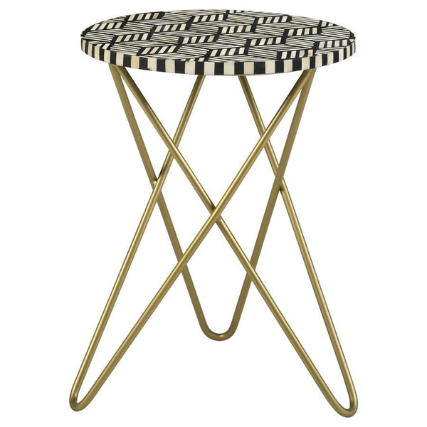 Make a bold statement with this elegant accent table, featuring a hand-inlaid bone and black resin mosaic that creates a striking geometric design. The round tabletop rests atop a sculptural butterfly-style hairpin metal base in a lustrous gold finish, ad