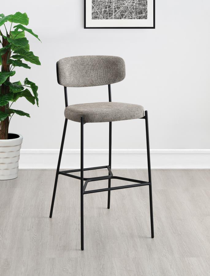 Create a relaxed and inviting ambiance at a kitchen bar or in your home lounge with a set of two modern barstools. Each boasts a durable and strong metal frame with a sandy black finish. Dark oak finish backrests complement neutral upholstery, offering fo