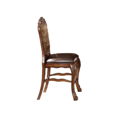 The Dresden traditional counter height dining creates a sophisticated feel to a classic look. This counter height chair with cherry oak finish features a highly decorative wood carved front legs with claw feet, faux leather padded seats, and perfectly mat