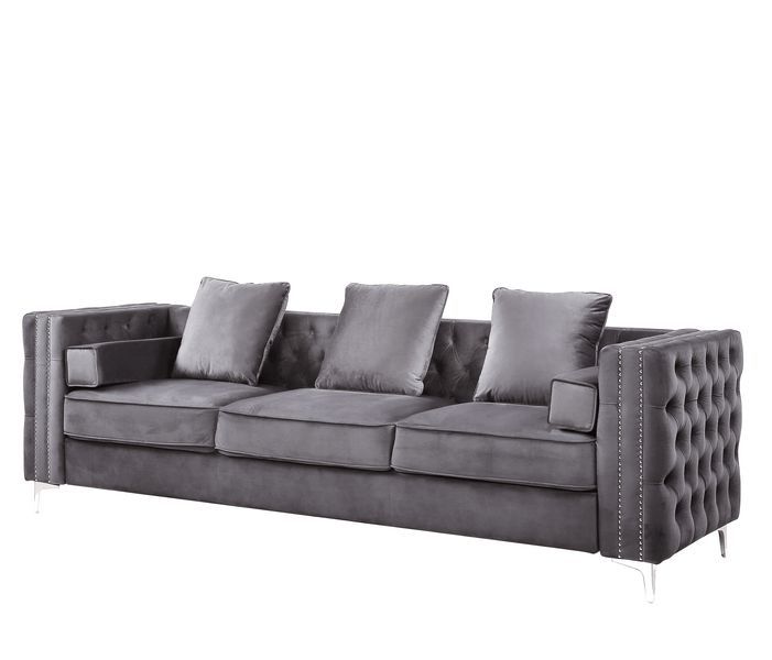 The Bovasis sofa and ottoman are ideal for smaller spaces. In a contemporary design featuring nailhead trim and sturdy metal legs. The beautiful velvet upholstery is soft to the touch and the button tufting adds dimension to the sofa. Pair it with the mat