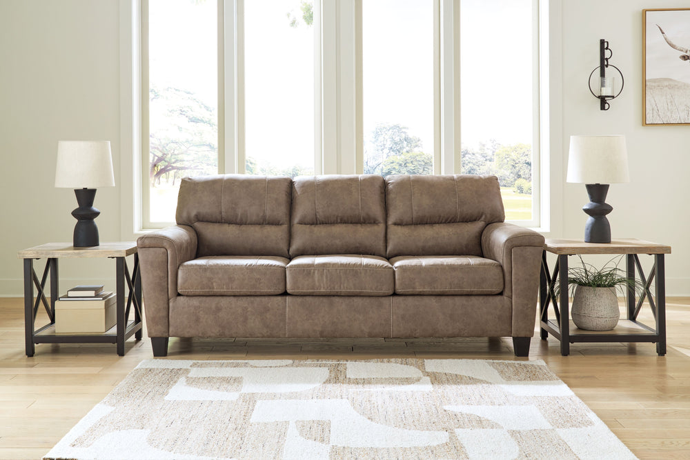 This decidedly modern sofa proves less is more, bringing simply inviting style to your living room. Take the guesswork out of decoratingâ€”its warm faux leather has a universal appeal, pairing with casual and contemporary aesthetics alike. All you need to