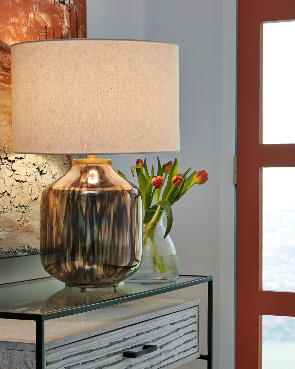 The warm luster of mercury glass highlights the silhouette of this table lamp. This accent piece adds grand elegant style while illuminating your fashionable home.<br><br><b>Additional Dimensions</b><br><ul><li>Shade: 0-"</li><li>Base: 0-"</li><li>Cord le