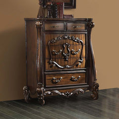 The Versailles chest is the perfect accent to create the style of royalty your bedroom has been needing. This chest crafted in wood with cherry oak finish was inspired by old European design with brown copper metal hardware and intricate wood carvings on 