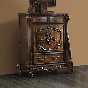 The Versailles chest is the perfect accent to create the style of royalty your bedroom has been needing. This chest crafted in wood with cherry oak finish was inspired by old European design with brown copper metal hardware and intricate wood carvings on 