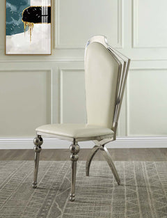 The Cyrene side chairs are padded with high-quality beige leatherette cushions, offering comfort while drawing attention to the elegant chrome finish metal frame. The architectural structure of the frame is eye-catching and glamorous. The foam seats are i