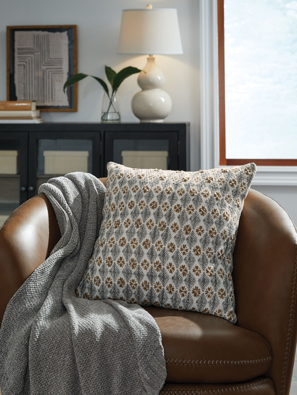 Make relaxing on your bed or sofa a little cozier with this accent pillow. Its embroidered diamond design in white, gray and brown goes with everything everywhere, instantly adding a subtle flair to your decor.<br/><br/><b>Product Features</b><ul><li>Made