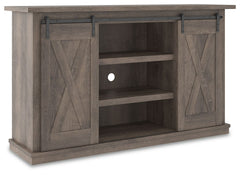 With its replicated weathered oak finish, crossbuck details and authentic charm, this TV stand is right in tune with your relaxed approach to high style. Beautifully made to accommodate your media equipment, itâ€™s well equipped with adjustable shelving, 