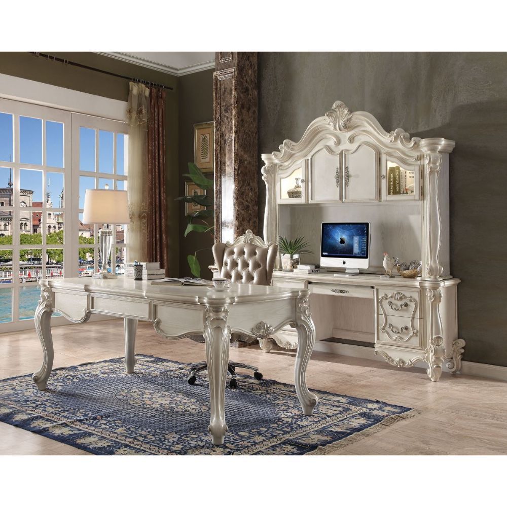 The Versailles office set was inspired by old European design. This collection features carved scrollwork accent with antique hand-brushed finish. The accent pieces crafted in wood with bone white finish and also included regal features such as ample stor