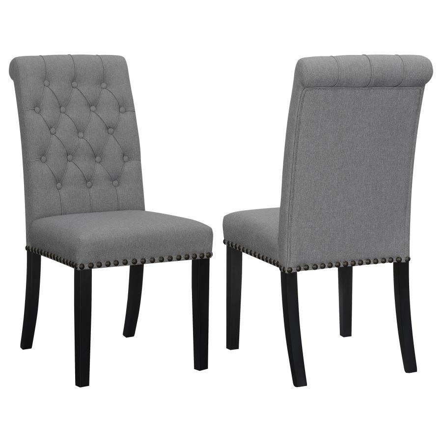 Blending timeless elegance with plush comfort, this side chair enhances any dining space. Its high backrest features a classic button-tufted design, adding depth and sophistication. A rolled top and hand-applied nailhead trim create refined detailing, whi