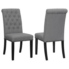 Blending timeless elegance with plush comfort, this side chair enhances any dining space. Its high backrest features a classic button-tufted design, adding depth and sophistication. A rolled top and hand-applied nailhead trim create refined detailing, whi