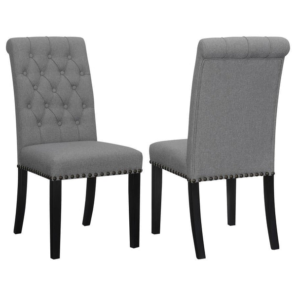 Blending timeless elegance with plush comfort, this side chair enhances any dining space. Its high backrest features a classic button-tufted design, adding depth and sophistication. A rolled top and hand-applied nailhead trim create refined detailing, whi