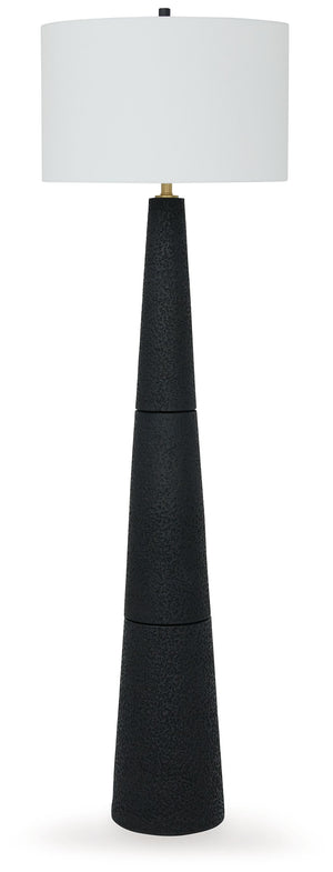 Like a contemporary aesthetic? Embrace it with this chic floor lamp. A mastery in minimalism, it wows with a textured black finish and stylish drum shade, offering a touch of refined elegance. This piece will illuminate your living area or home office wit