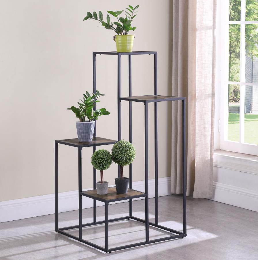 Make a statement with a tiered shelving unit. Four open shelves create the perfect place for displaying your favorite decor items. Its industrial design is enhanced with a black metal frame. Meanwhile, the rustic wood finish makes a contrast against the f