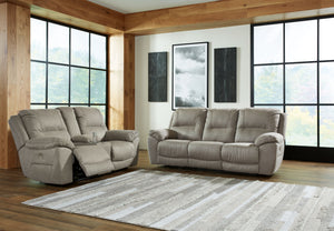 Kick back, relax, and enjoy some sports on TV with this power reclining set. You will love its double stuffed pillow top arms and soft-as-suede faux leather upholstery. Family-friendly dark gray color and creative stitching add panache. Recline in infinit