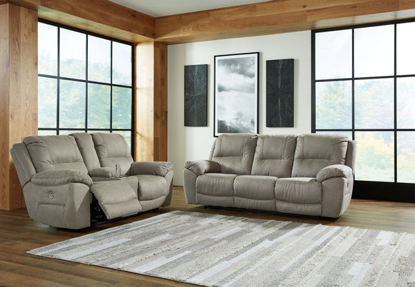 Kick back, relax, and enjoy some sports on TV with this power reclining set. You will love its double stuffed pillow top arms and soft-as-suede faux leather upholstery. Family-friendly dark gray color and creative stitching add panache. Recline in infinit