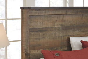  plank-style details and nailhead trim pay homage to reclaimed barn wood