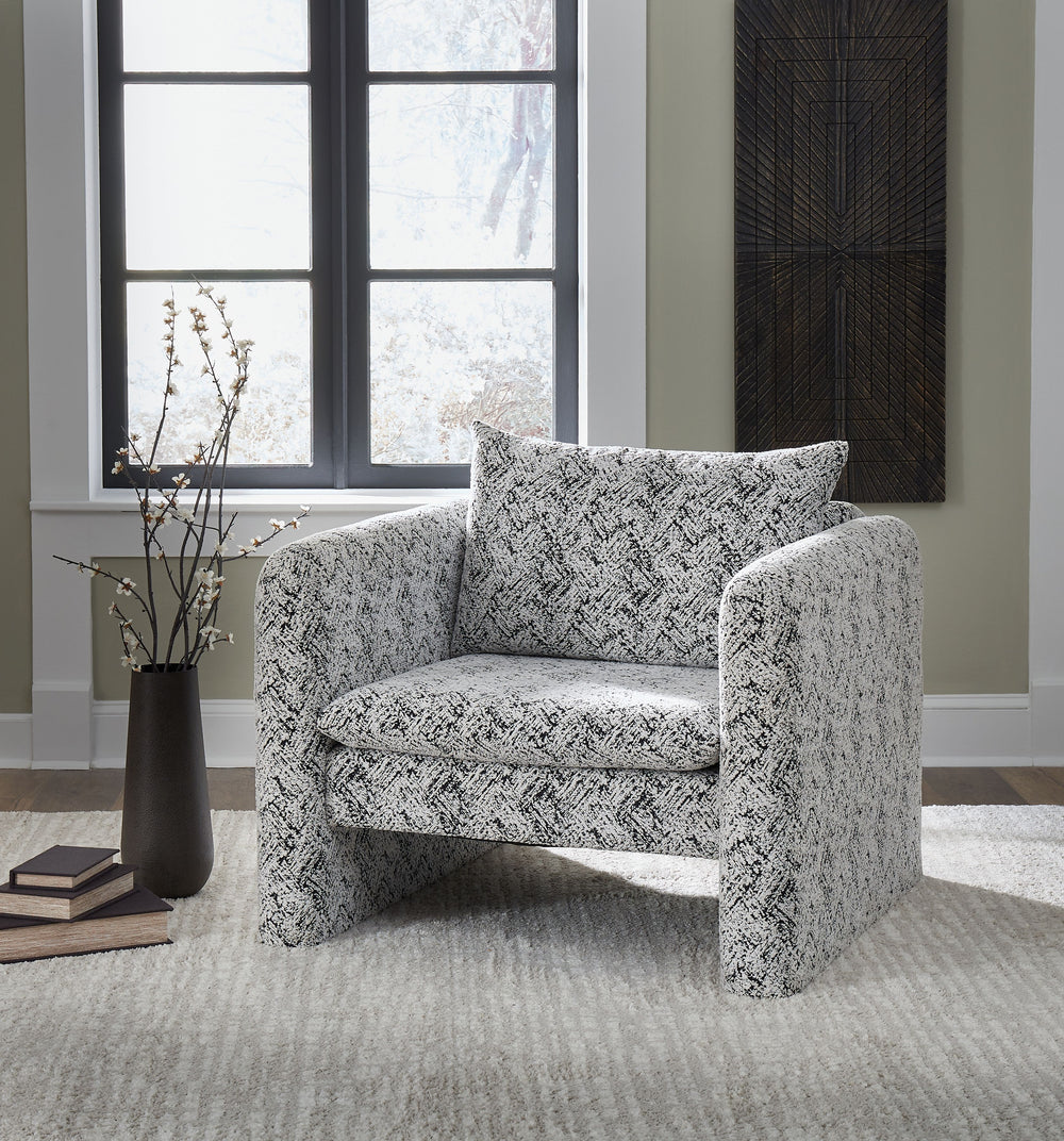 This fashion-forward accent chair keeps comfort and contemporary style at top of mind. Its eye-catching black and white geometric pattern makes a bold statement while remaining versatile enough to pair with other neutrals or pops of color. A low-profile b