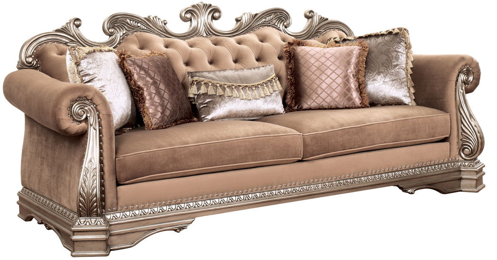 The Northville sofa is exclusively designed and filled with romantic spirit. This beautiful velvet upholstered sofa features carved legs, apron, and trim, decorated with raised and scrolled floral motifs in an antique silver finish. This sophisticated sof