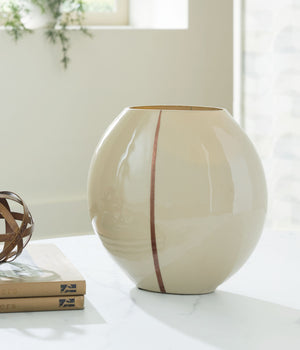  shelf or foyer with this vase. An eye-catching metallic accent showcases its softly rounded shape