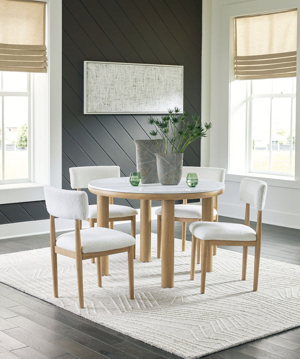 Clean lines meet cool curves with this dining set. Chunky round post legs and a natural finish lend a modern vibe, while chairs with softly textured upholstery tempt you to sit and stay awhile. What a delicious choice for a dining room update. <h4><b>Sawd