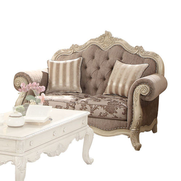  crown and raised scrollwork ornamental trim and button tufted backrest. Accent pillows are 